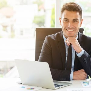 portrait-of-handsome-businessman-sitting-with-smile-in-office-administrator-executive-manager-or-boss_t20_jod8PX